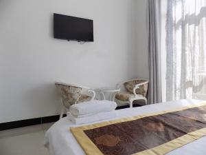 Postel nebo postele na pokoji v ubytování Remmings Hotel Kampala
