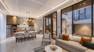 a living room with a couch and a table at Alcola Boutique Villa - Dania Unit in Tlekung