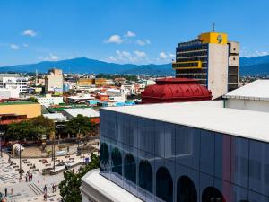 a view of a city from the top of a building at Hotel Maragato in San José