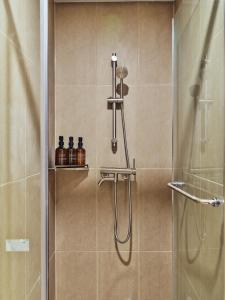 a bathroom with a shower with a glass door at 수수하우스 서울 in Seoul +29 photos