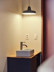 a bathroom with a white sink and a mirror at 수수하우스 서울 in Seoul