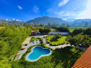an aerial view of a garden with a swimming pool at Runaway Hotel in Carhuaz