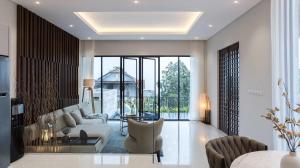 a living room with a couch and a table at Alcola Boutique Villa - Astonia Unit in Batu