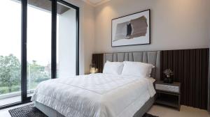 a bedroom with a large white bed and large windows at Alcola Boutique Villa - Astonia Unit in Batu +31 photos