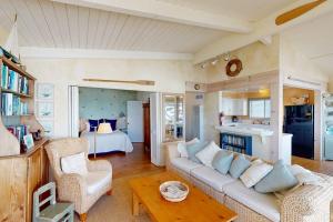 a living room with a couch and a bed at Oceanfront Dream in Cayucos
