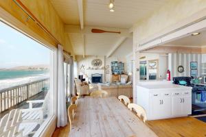 a living room with a view of the ocean at Oceanfront Dream in Cayucos
