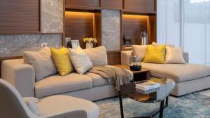 a living room with two couches and a table at Alcola Boutique Villa - Bahama Unit in Malang +30 photos