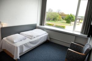 Postel nebo postele na pokoji v ubytování Vingsted Hotel & Konferencecenter