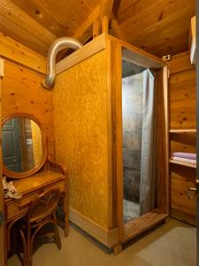a bathroom with a mirror and a dressing table and a mirror at BIRD-LOGG Amami in Amami