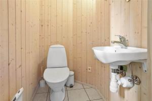 a bathroom with a toilet and a sink at 13376-Asnaes-Dommergardsvej-18 in Asnæs