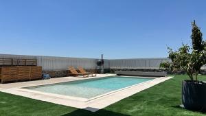 a swimming pool in the middle of a yard at Private Pool Retreat for Two - Golan in Qasrîne