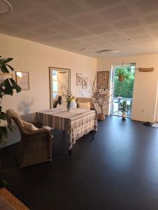 a dining room with a table and chairs at Nice room with a wonderful view in Sommersted