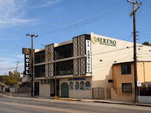 a building on the corner of a street at Sereno Business Inn in Ensenada