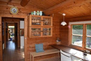 a wooden cabin with a bench in a dining room at 10084-1-Rorvig-Sondervangen-12 in Rørvig