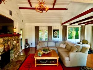 a living room with a couch and a table at EPIC VIEWS, Large Deck, BBQ, Private, Close to Julian, Great for Families or Entertaining in Julian