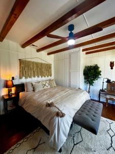 a bedroom with a large bed with a ceiling fan at EPIC VIEWS, Large Deck, BBQ, Private, Close to Julian, Great for Families or Entertaining in Julian