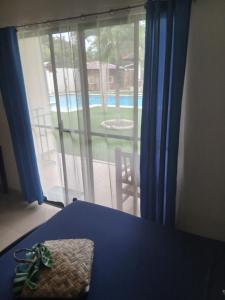 a room with a window with a view of a pool at HIGALA Resort in Panglao Island