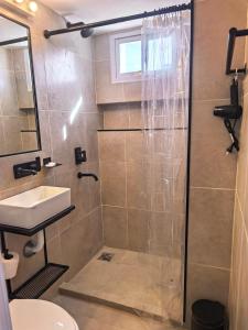 a bathroom with a shower and a sink at LA CASA Nostra in Valle Hermoso +40 photos