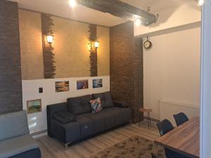 a living room with a couch and a table at Stefanovic in Valjevo