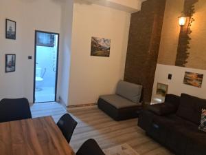 a living room with a couch and a table at Stefanovic in Valjevo