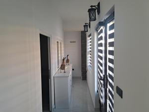 a hallway of a house with white walls and a counter at Stefanovic in Valjevo
