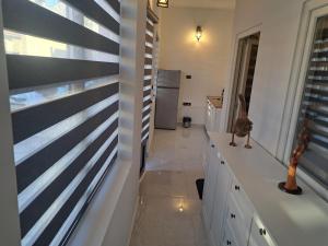 a kitchen with black and white stripes on the wall at Stefanovic in Valjevo