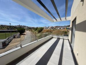 a view from the balcony of a house at Vila Grafenola in Montargil +4 photos