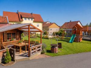 a backyard with a gazebo and a playground at Einzelzimmer in Kelheim