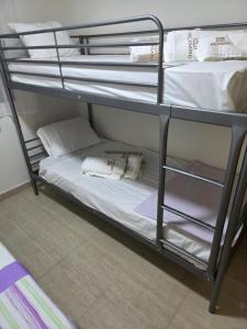 a couple of bunk beds with towels on them at Mar de Cristal in Mar de Cristal
