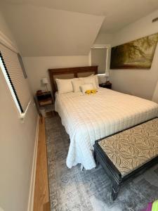 a bedroom with a large white bed in a room at Gorgeous Home in Prime Location in Sauk City