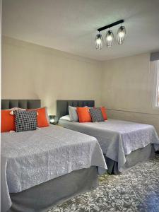two beds sitting next to each other in a room at Casa 96 in Guatemala +30 photos