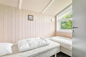 a bedroom with two beds and a window at LF750-Vestervig-Gunhildsvej-30 in Vestervig