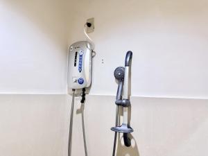 a hair dryer hanging on a wall at MF Suites in Manolo Fortich
