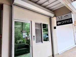 an office entrance with a sign on the door at MF Suites in Manolo Fortich