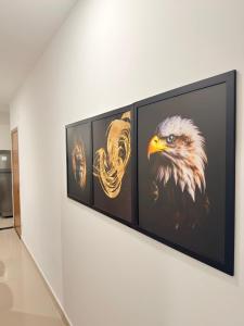 a painting of an eagle on a wall at Auréa Residência - a 500 m da Praia in Cabedelo