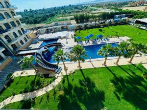 an aerial view of a resort with a water slide at منتجع لوريت in Qaryat at Ta‘mīr as Siyāḩīyah