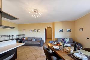 a living room with a table and a couch at Clubhouse in Menaggio