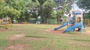 a playground with a slide in a park at Vacation Villa - Katunayake in Kotugoda