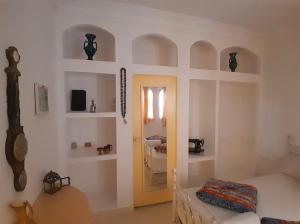 a room with a bedroom with a bed and a door at San Marcelo De Tangier in Tangier +4 photos