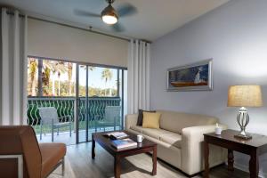 a living room with a couch and a table at Meliá Orlando Celebration in Orlando +83 photos