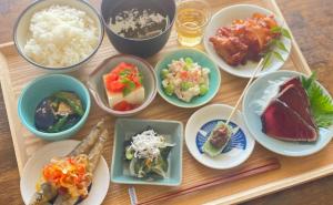 a tray with plates of food on a table at WELLNESS PARK IWAKI Iwaki Yuttarikan in Iwaki
