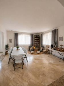 a large living room with a table and chairs at Trip Nest Homestay in Manila