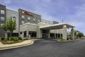 a hotel building with a parking lot in front of it at Hilton Garden Inn Jackson in Jackson
