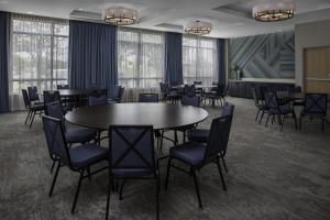 a conference room with tables and chairs and windows at Hilton Garden Inn Jackson in Jackson +32 photos