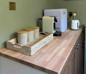 a kitchen counter with a coffee maker on top of it at The Warwick Room in Warwick