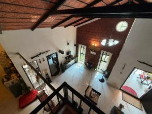 an overhead view of a living room with a brick wall at Koppalu Heritage in Vastāra +34 photos