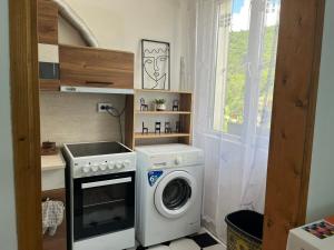 a laundry room with a washing machine and a washer at Апартамент ''Габрува'' in Gabrovo +11 photos