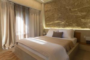 a bedroom with a large bed and a window at Villa Steana in Makri +42 photos