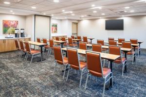 a conference room with tables and chairs and a screen at Hampton Inn & Suites Prescott Valley in Prescott Valley +46 photos