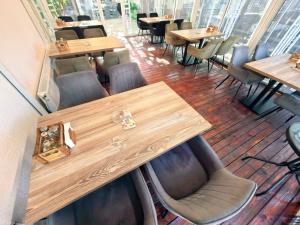a row of tables and chairs in a restaurant at Hotel Trakia in Plovdiv